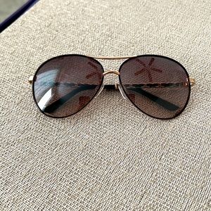 Tahari sunglasses. Minor scratches. Case included.